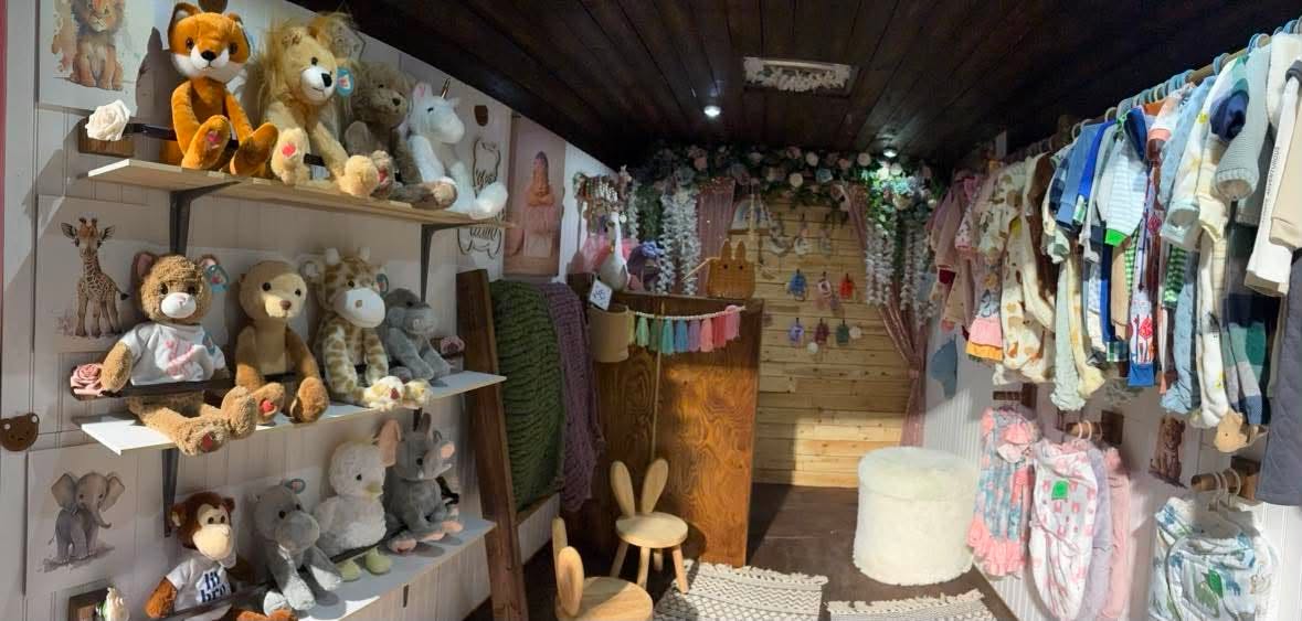The Baby Beats studio room set up with florals, soft shelving and seating.
